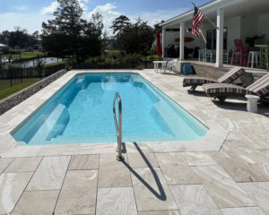 complete backyard transformation with fiberglass pool and fire feature Akron Ohio